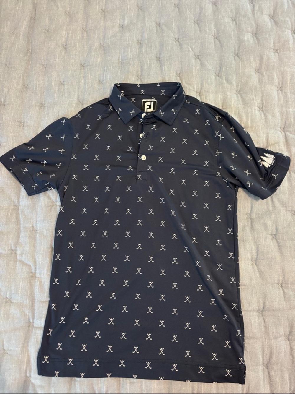 FootJoy boy’s Navy Polo with White Crossed-Club Print